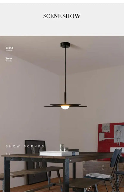 Black minimalist flying saucer chandelier by decorbites with sleek modern design and warm led glow from central bulb