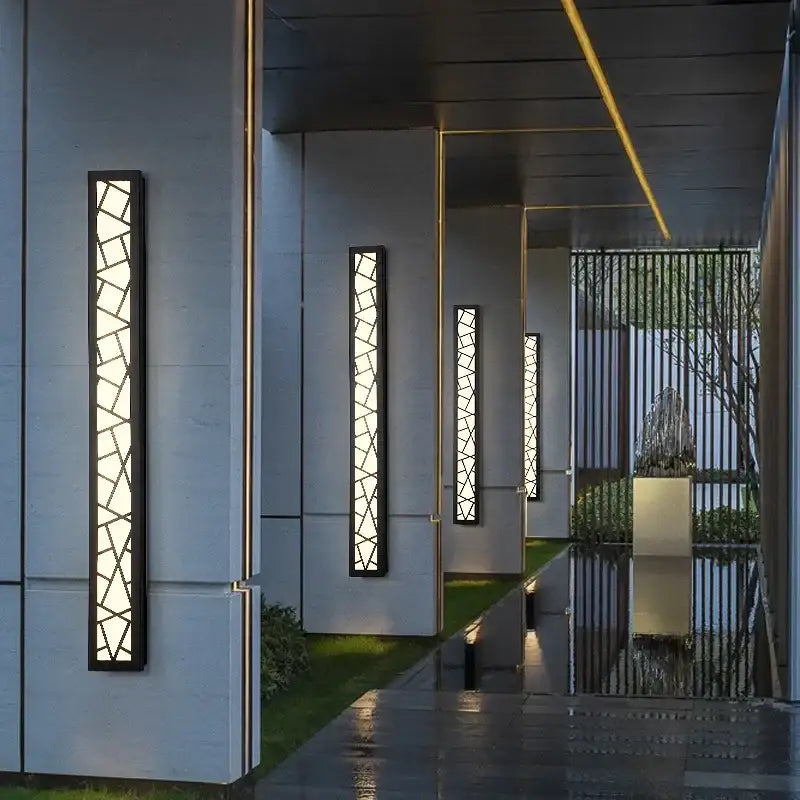 Modern black-framed outdoor wall lamp with geometric glass panels and warm LED light for villa porch, aluminum IP65