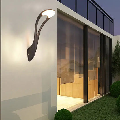 Modern black DecorBites™ LED outdoor wall lamp with sleek curved design and warm white light for garden or balcony use