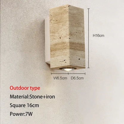 A decorbites led outdoor wall lamp featuring a textured beige stone and iron 16cm square design with integrated led light