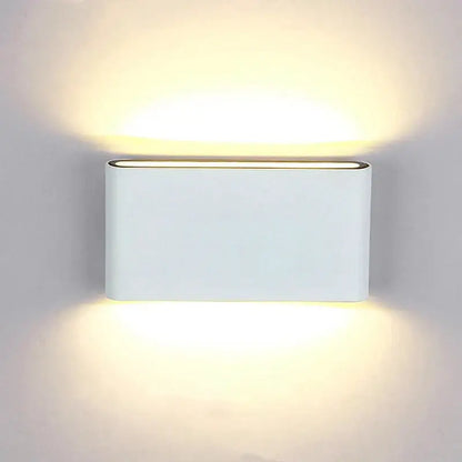 White rectangular decorbites led outdoor wall light with aluminum body and warm ambient glow for outdoor use