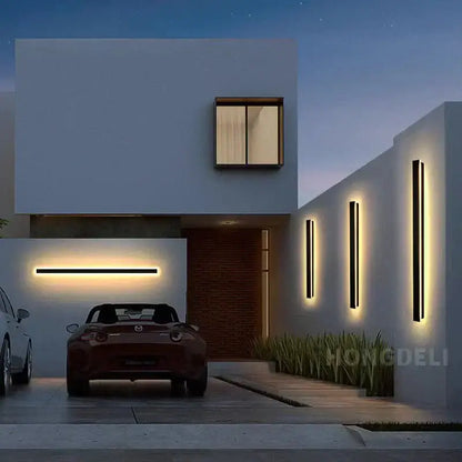 Decorbites led outdoor wall light in waterproof aluminum mounted on a white modern house with a maroon mazda mx-5 miata