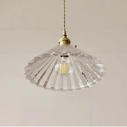 Clear fan-shaped glass pendant lamp with brass fixture and exposed filament bulb by DecorBites LED pendant lamp