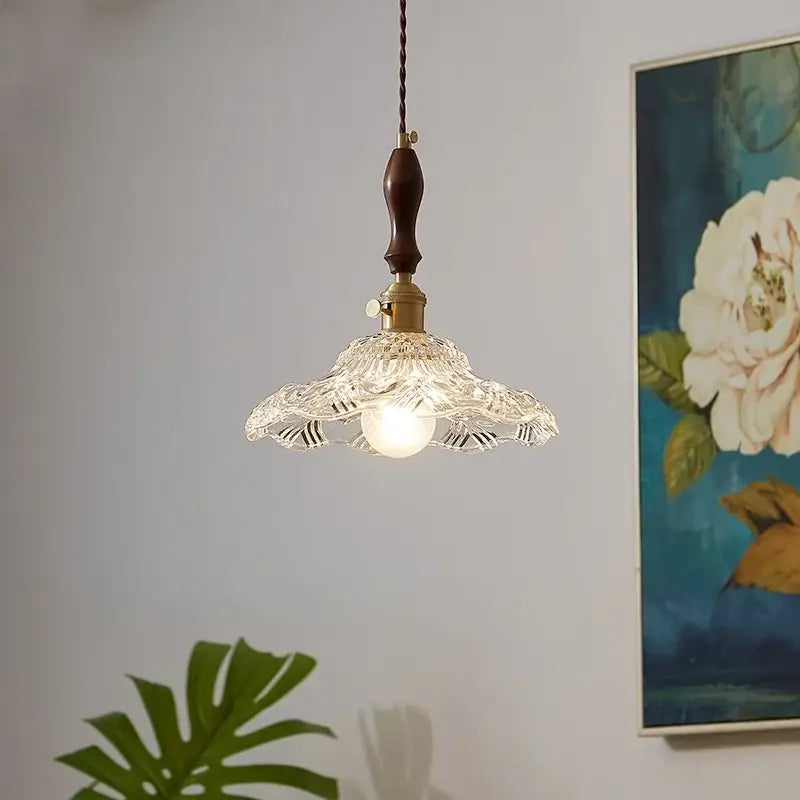 Decorbites led pendant lamp featuring a delicate clear glass pendant light with fluted design and dark wood hanging rod