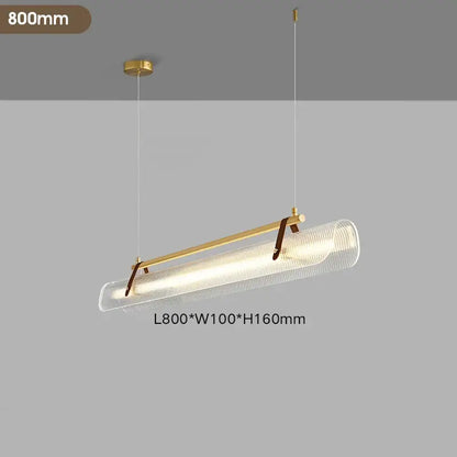 A modern decorbites led pendant lamp with gold metal frame, clear textured glass diffuser, and brown leather straps