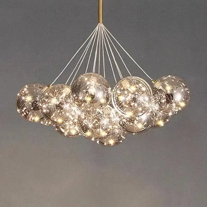 Modern glass globe DecorBites led pendant chandelier with warm LED lights and gold-toned rod for living and dining rooms