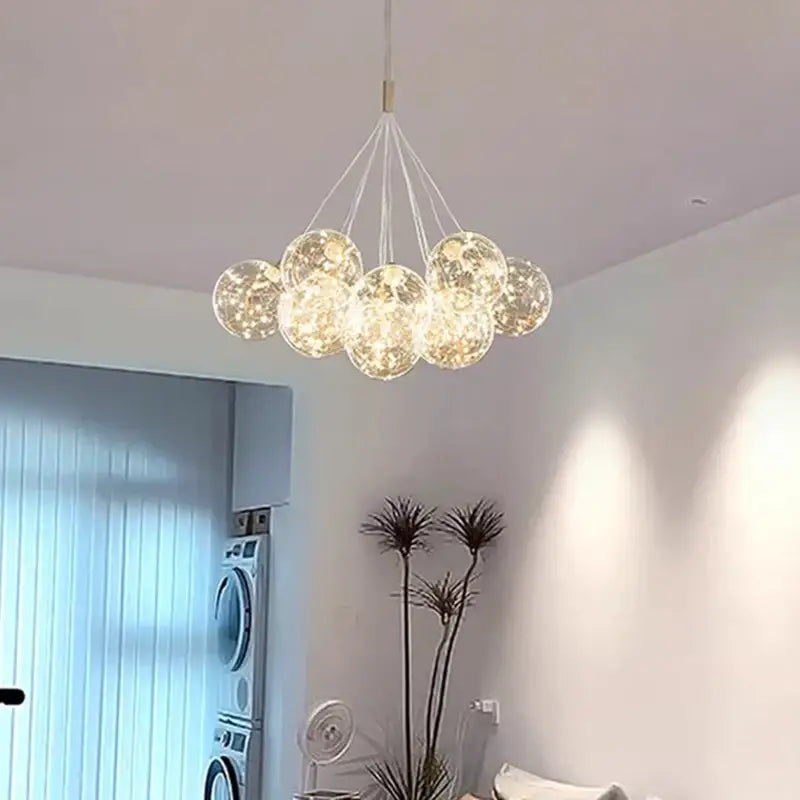 A modern decorbites led pendant chandelier with translucent glass spheres and warm led pendant light for living room decor