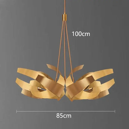 A modern gold-toned metal decorbites led pendant light chandelier with sculptural ribbon-like arms for indoor use