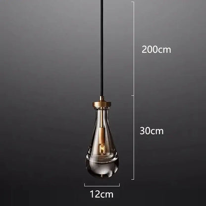 A sleek teardrop-shaped decorbites led pendant light with brass-finished metal top for indoor living room lighting