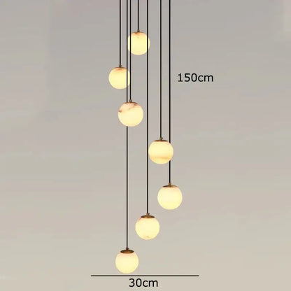 Modern decorbites led pendant light with seven cream marbled glass globes suspended by black cords for indoor use
