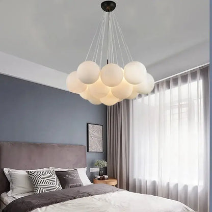 A modern decorbites led pendant light chandelier with frosted white glass bulbs and black ceiling fixture for indoor decor