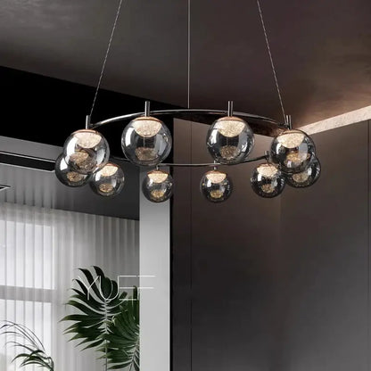 Modern chrome-finished DecorBites LED pendant light chandelier with spherical glass globes and warm-toned LED lights