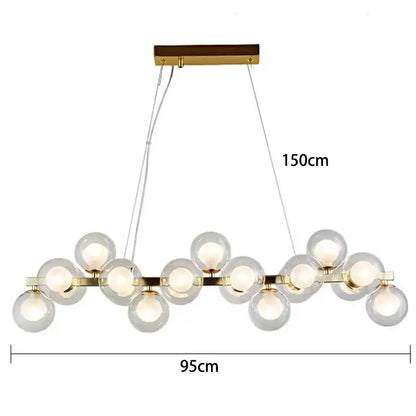 Gold-toned decorbites led pendant light chandelier with clear glass globe bulbs in a linear pattern for modern home decor
