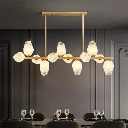 Gold-toned decorbites led pendant light chandelier with faceted translucent glass shades in modern geometric pattern