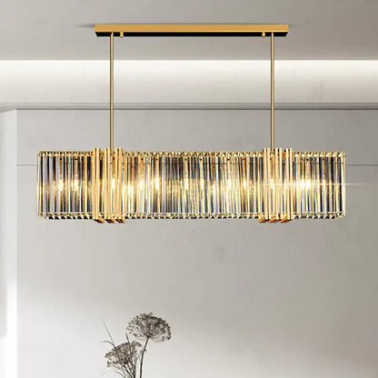 Gold-toned decorbites led pendant light chandelier with vertical crystal rods and warm glowing lights for modern decor