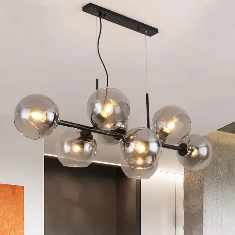 Modern black metal DecorBites led pendant chandelier with six smoked glass globes for living and dining room decor
