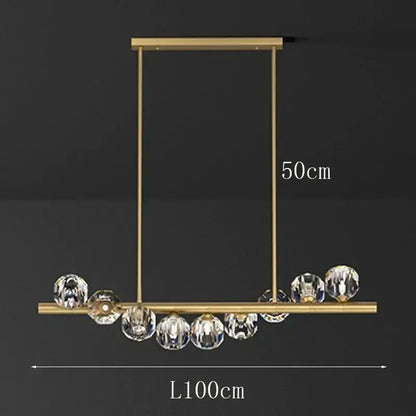 Gold-toned decorbites led pendant light chandelier with a sleek rectangular frame and clear crystal spheres for modern spaces