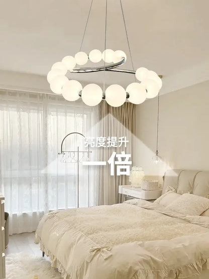 Modern chrome-finished DecorBites™ pendant light chandeliers with frosted glass globe lights for living and dining rooms
