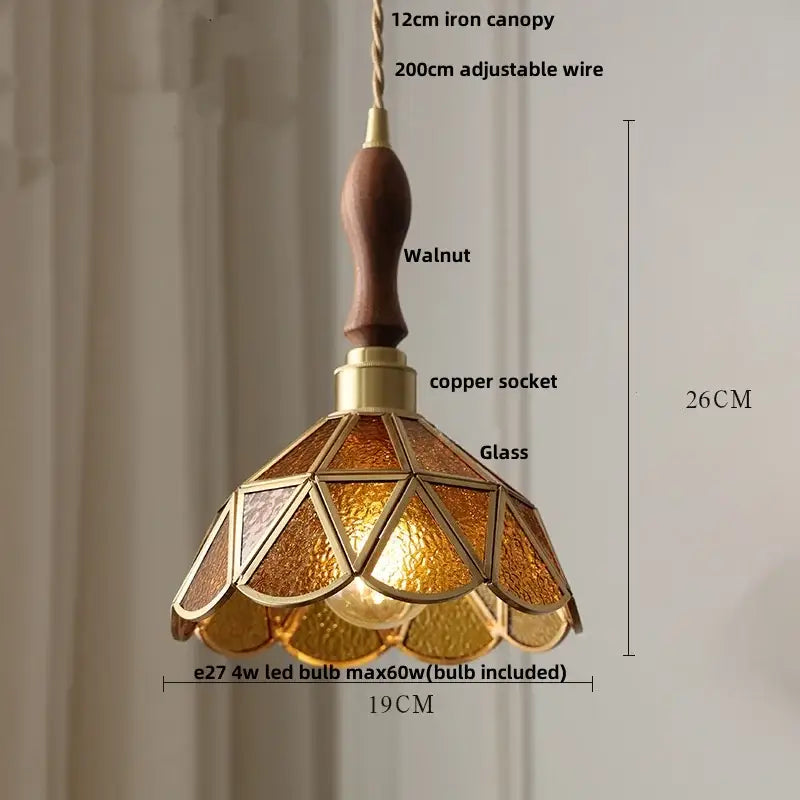 Warm amber-tinted decorbites led pendant light with walnut wooden handle and brass accents for modern living spaces