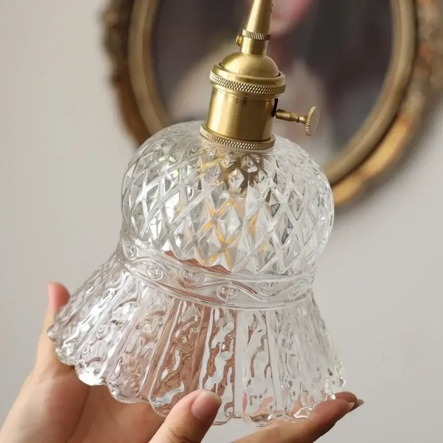 Clear cut glass pendant light with brass-finished socket and diamond-cut patterns in decorbites led pendant light