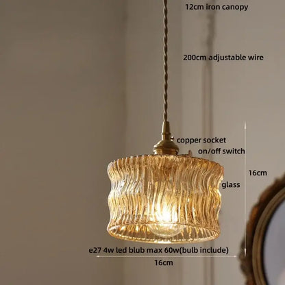 DecorBites led pendant light fixture with green textured glass, iron canopy, and copper socket in warm tones