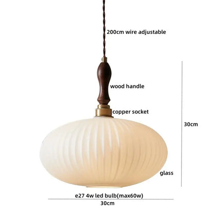 Cream-colored ribbed glass pendant light with dark wood handle and copper socket in decorbites led pendant light fixture