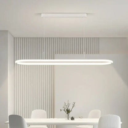 A sleek white rectangular DecorBites led pendant light with minimalist design hanging for dining and kitchen use