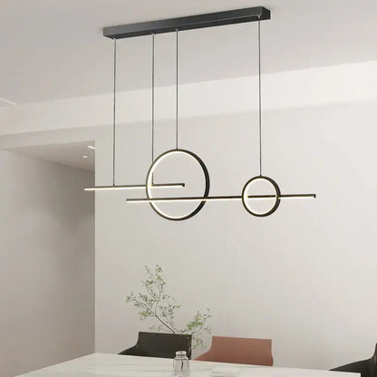 Modern black minimalist DecorBites LED pendant light with sleek circular and linear LED elements for indoor use