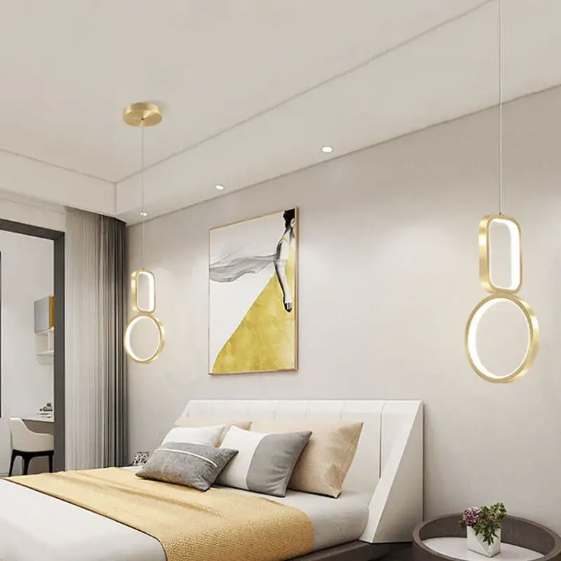 Modern gold-toned decorbites led pendant light features sleek interconnected circular design for indoor use