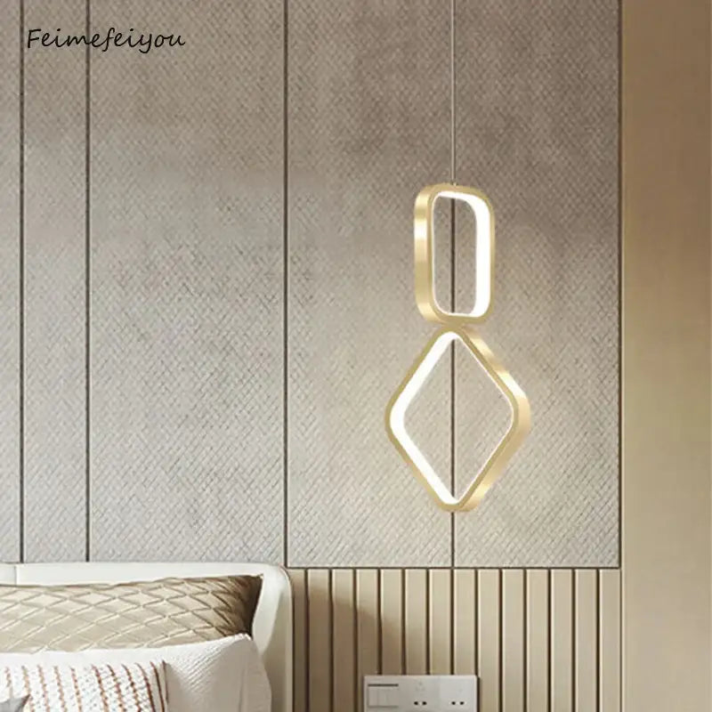 Modern gold-toned geometric decorbites led pendant light with interlocking oval and diamond frames for indoor use