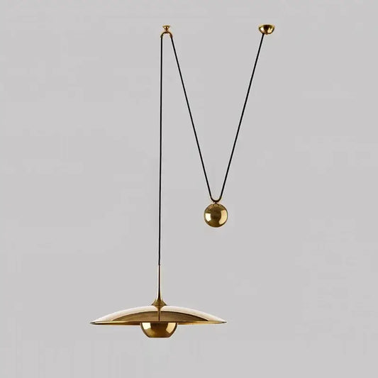 Gold-toned decorbites led pendant lighting with sleek disc shade and black cord suspension ideal for bedroom and dining room