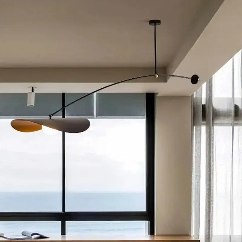 Modern black metal decorbites led pendant lights with sleek curved arm and layered gray and amber shades for home decor