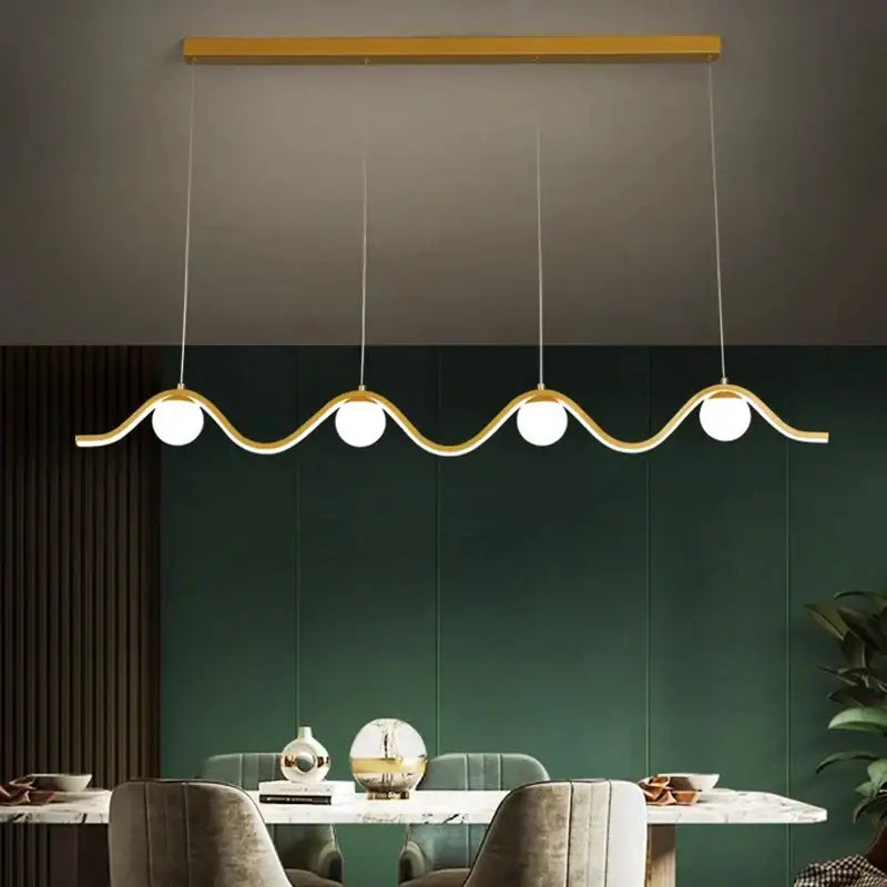 Modern gold-toned decorbites led pendant light with wavy design and four spherical bulbs for indoor lighting