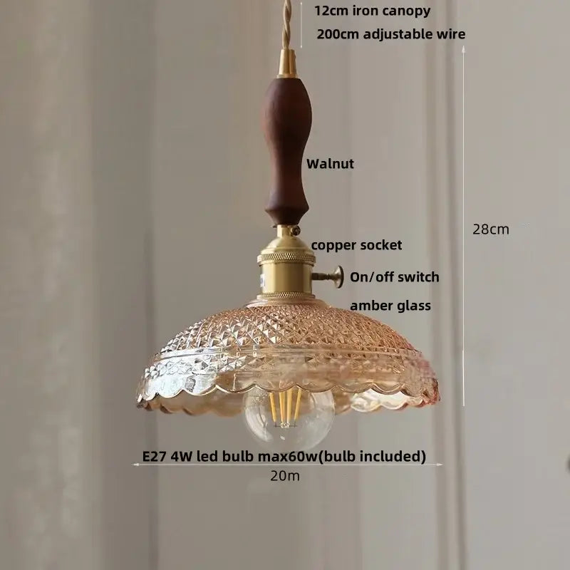Vintage-style decorbites led pendant light with dark walnut canopy, brass socket, and scalloped amber glass shade