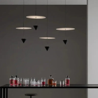Modern minimalist decorbites led pendant lights with black and white geometric shapes hanging from thin cords