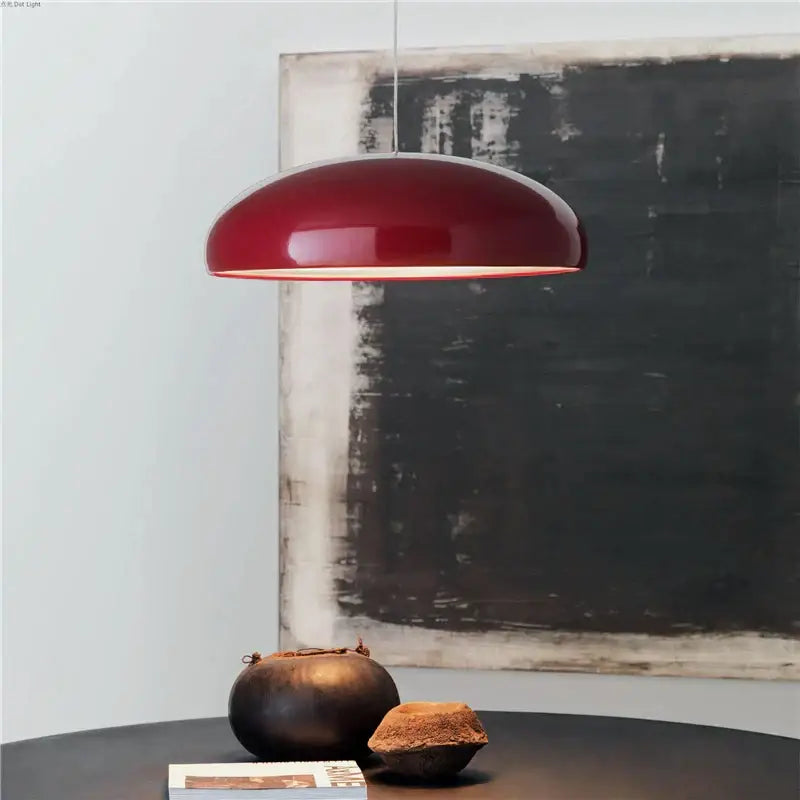 A sleek, glossy red dome-shaped decorbites led pendant light suitable for living, dining, kitchen, and restaurant spaces