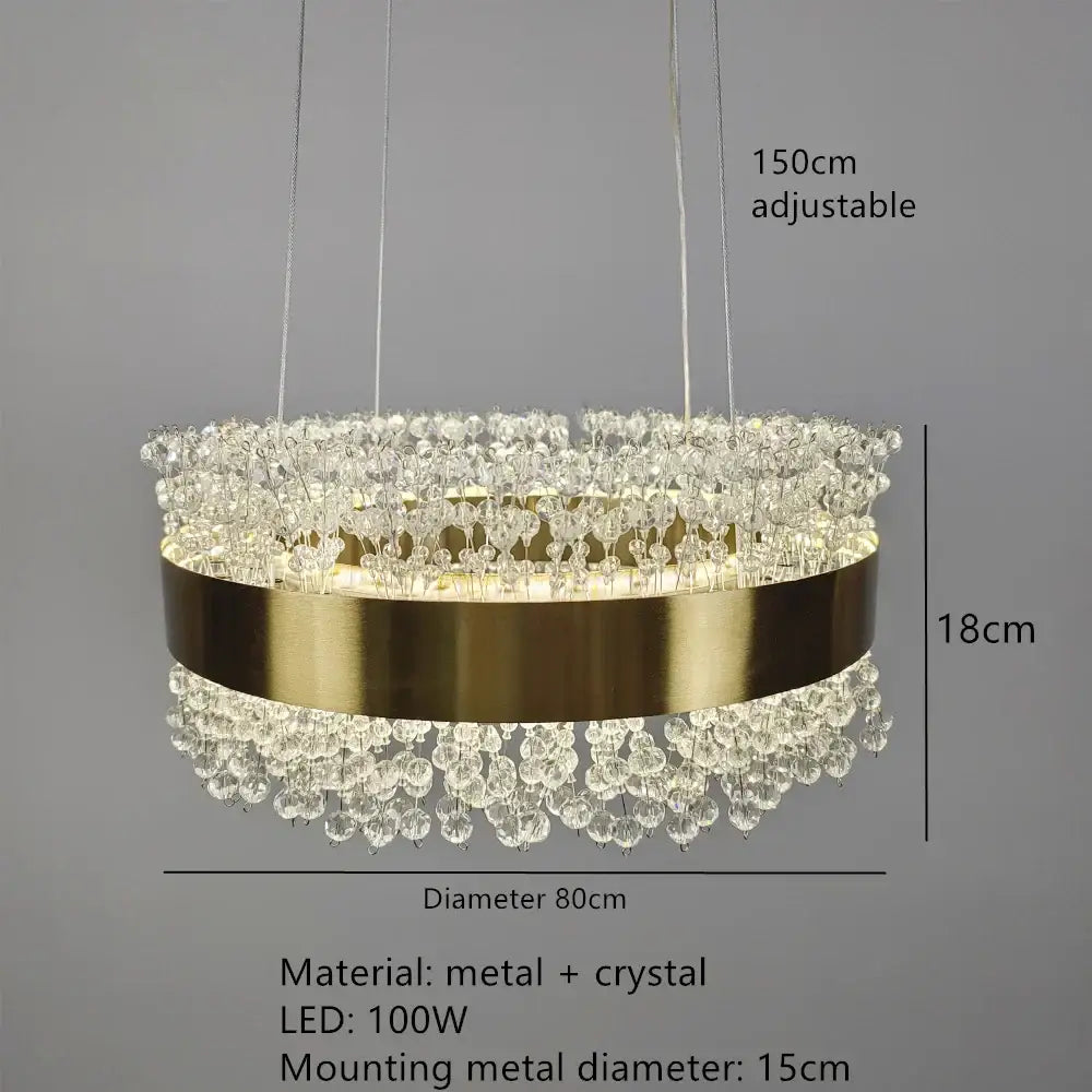 Gold-toned decorbites led pendant light with clear crystal droplets and sleek metallic band for modern interior decor
