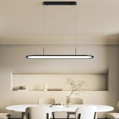 Modern black rectangular decorbites led pendant light with minimalist design hanging above dining table for indoor lighting