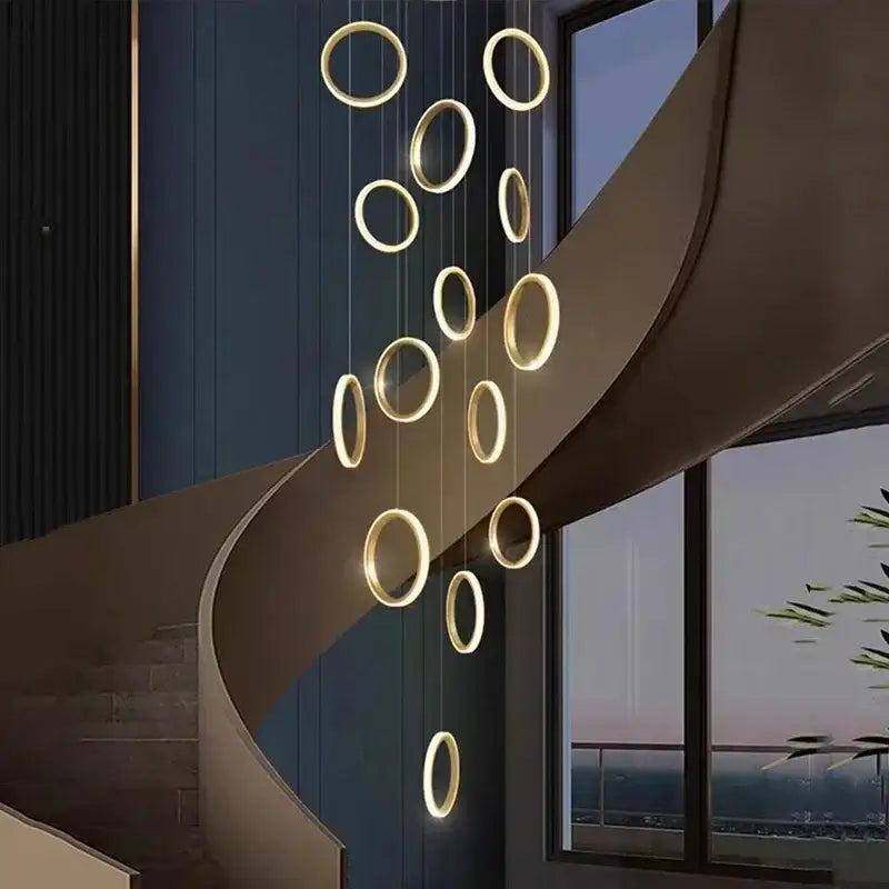Golden circular led pendant lights by decorbites hang in a modern minimalist arrangement for living and dining rooms