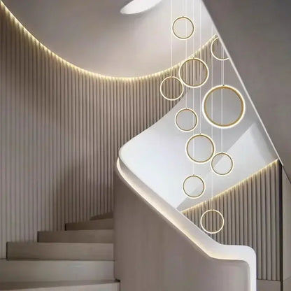 Modern gold-toned led pendant lights with circular illuminated edges by decorbites for living and dining rooms