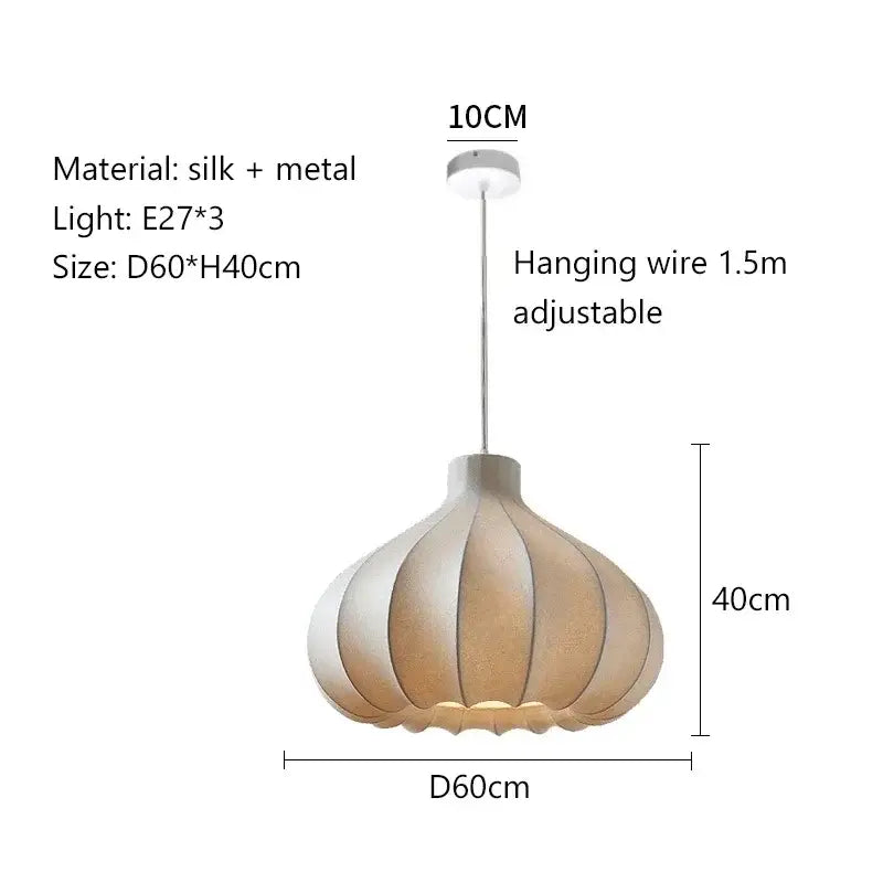 A modern decorbites led pendant light with a pleated beige silk shade and metallic accents for stylish lighting