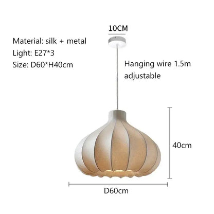 A modern decorbites led pendant light with a pleated beige silk shade and metallic accents for stylish lighting