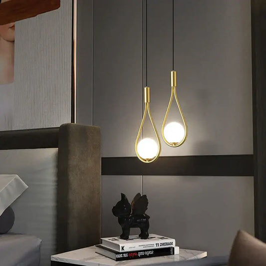 Two elegant gold-toned decorbites led pendant lights with teardrop frames and bright g9 bulbs for indoor chandelier use