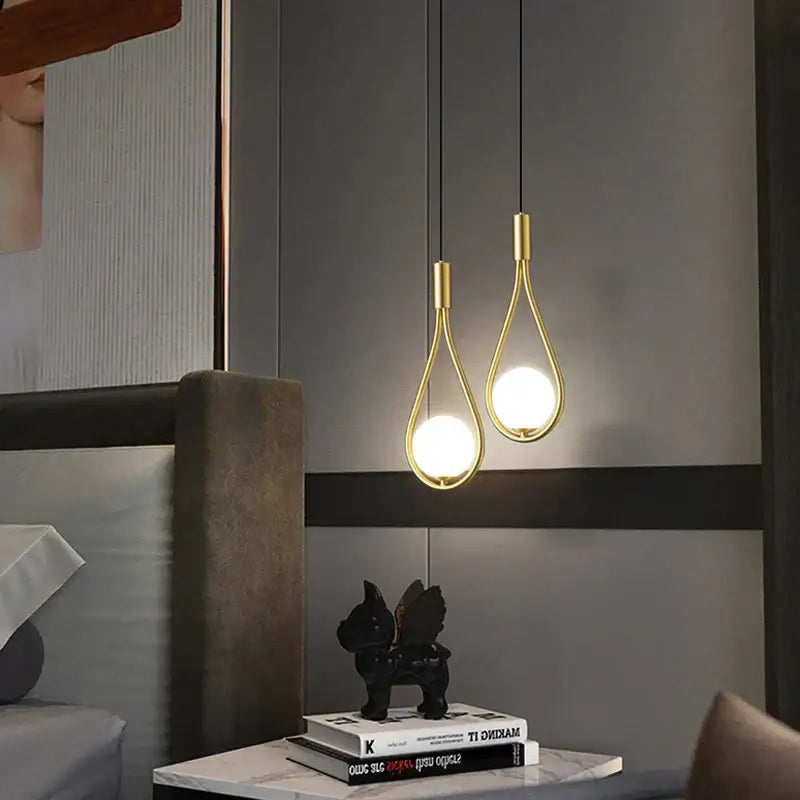 Two elegant gold-toned decorbites led pendant lights with teardrop frames and bright g9 bulbs for indoor chandelier use