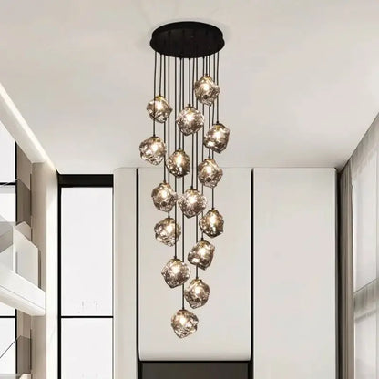 A decorbites led pendant light with black circular mount and warm crystal glass orbs for led pendant staircase lighting