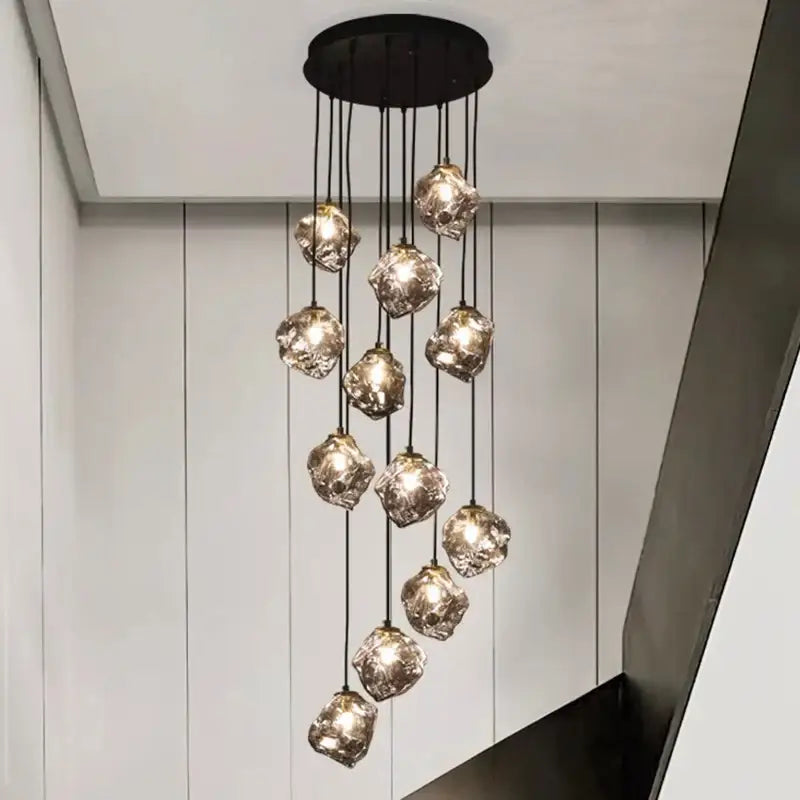 A modern black decorbites led pendant light with irregular translucent glass globes for indoor LED pendant staircase use
