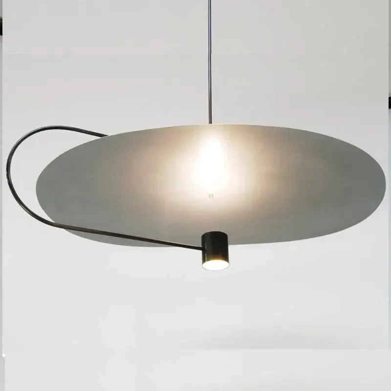 Modern minimalist DecorBites™ pendant light fixture with matte gray circular shade and sleek black metal frame for indoor use