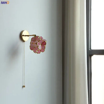 Delicate pink floral decorbites led petal wall sconce with gold metal accents and pull chain switch for stair mirror lighting