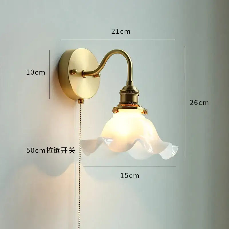 Vintage-style brass wall sconce with frosted glass lampshade and ruffled edges from DecorBites led petal wall series