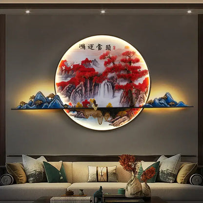 DecorBites™ LED pine landscape wall light with circular illuminated red and blue mountain scene and gold-toned frame
